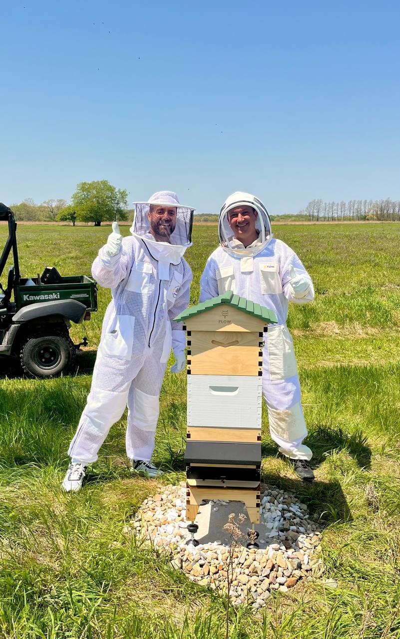 Beekeeping partners thumbs up